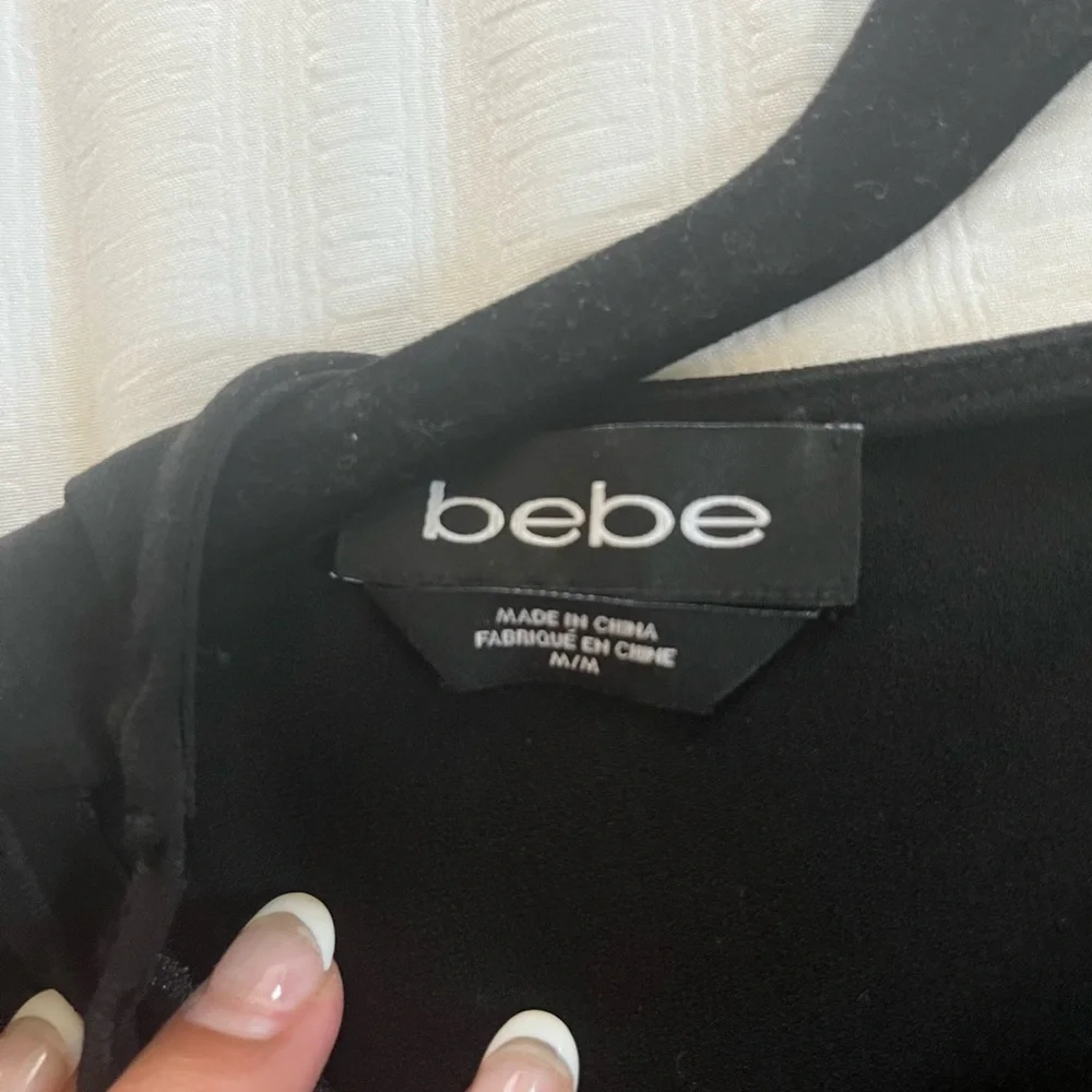 Bebe Laser Cut Floral Cropped Blouse with Scalloped Hem in Black medium top - Picture 4 of 4